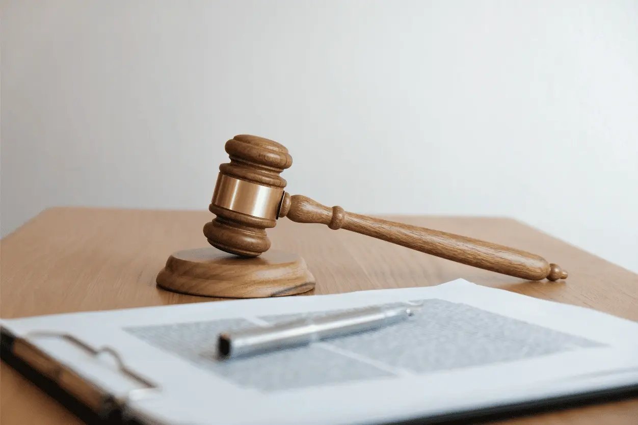 gavel and paperwork for legal considerations wholesaling real estate in california